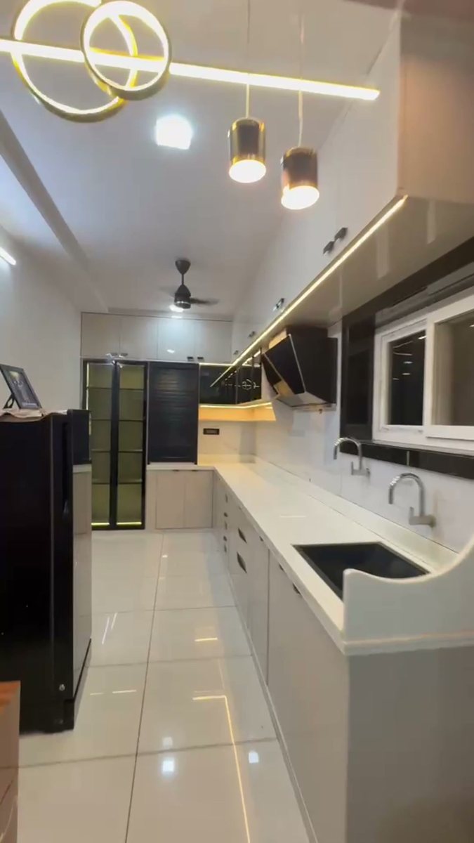 L-shaped white counter with twin sinks