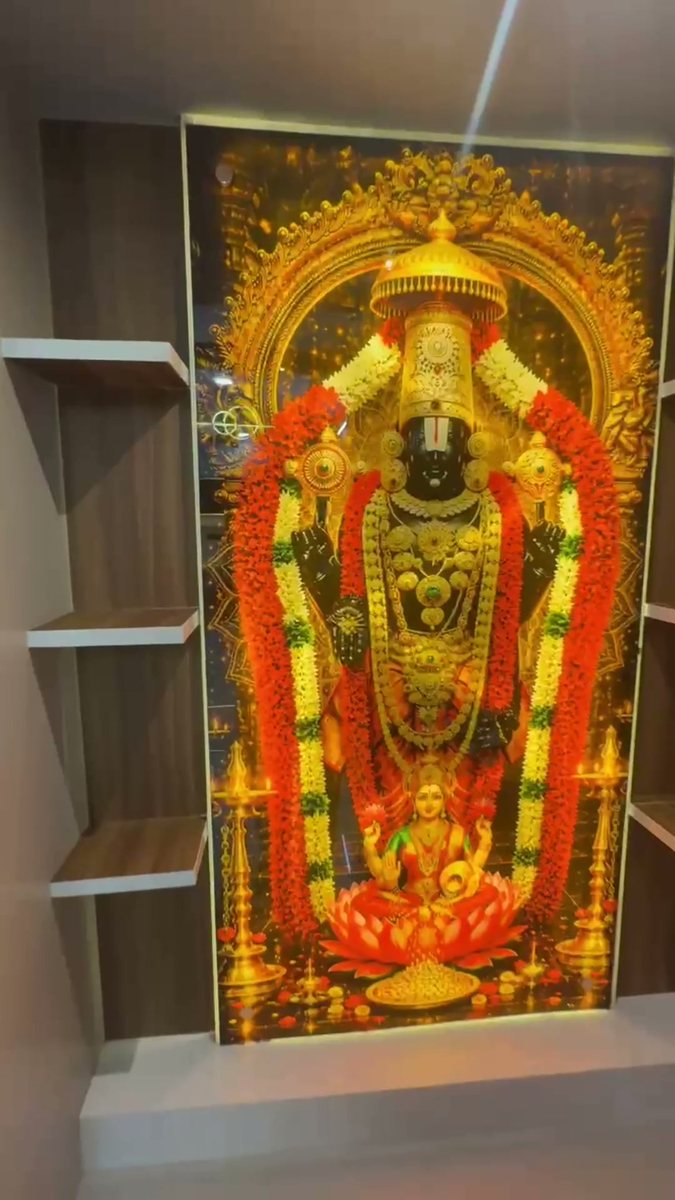 Pooja unit open on a Venkateswara print
